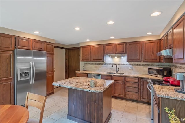 8807 Wandering Way, Lysander, NY 13027 - kitchen with stainless steel appliances, a sink, range hood, light tile patterned floors, and recessed lighting