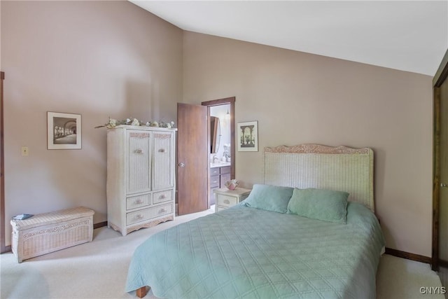 8807 Wandering Way, Lysander, NY 13027 - bedroom featuring vaulted ceiling, carpet flooring, baseboards, and ensuite bath