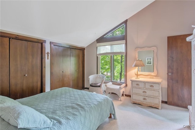 8807 Wandering Way, Lysander, NY 13027 - carpeted bedroom with multiple closets, multiple windows, vaulted ceiling, and baseboards