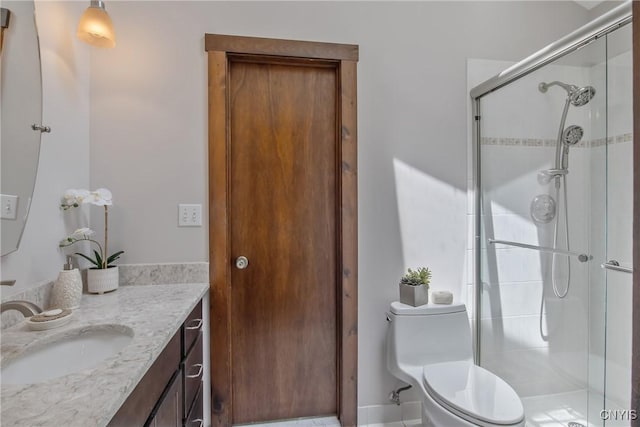 8807 Wandering Way, Lysander, NY 13027 - bathroom with toilet, vanity, and a shower stall