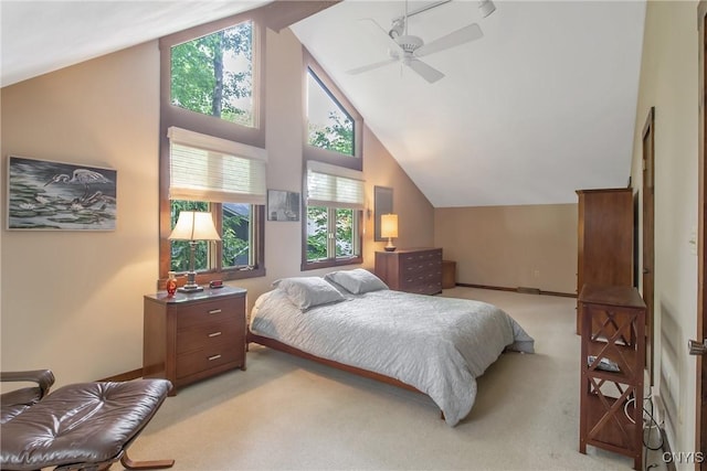 8807 Wandering Way, Lysander, NY 13027 - bedroom with vaulted ceiling, light carpet, multiple windows, and ceiling fan