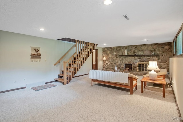 8807 Wandering Way, Lysander, NY 13027 - living room featuring stairs, carpet, recessed lighting, baseboards, and a fireplace