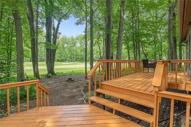 8807 Wandering Way, Lysander, NY 13027 - wooden terrace with view of wooded area