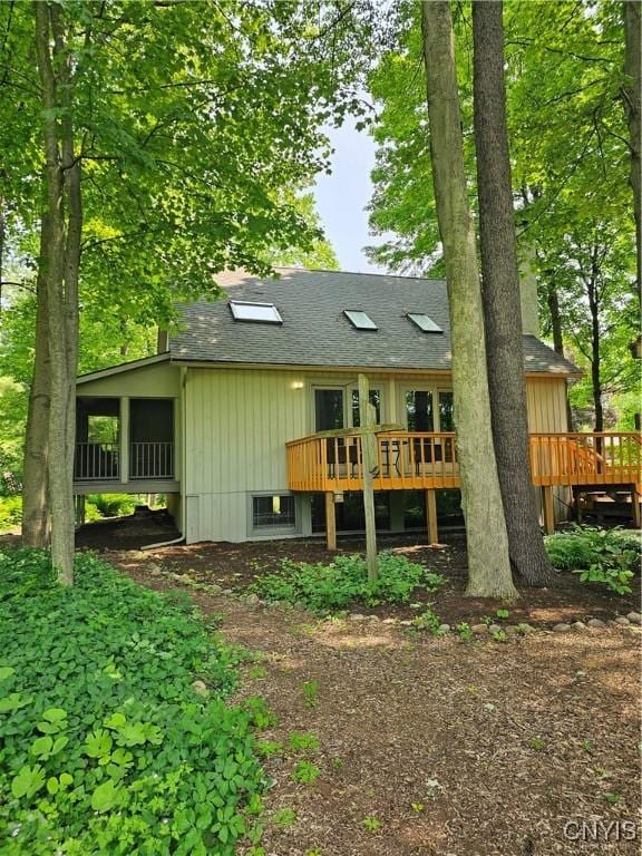 8807 Wandering Way, Lysander, NY 13027 - back of house featuring a wooden deck and a shingled roof
