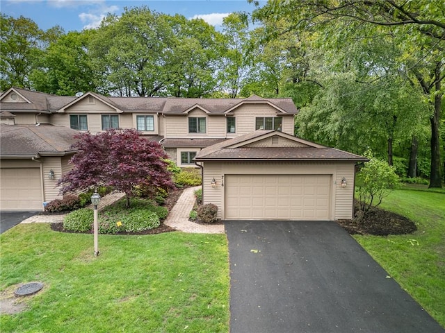 716 Mariner Cir, Webster, NY 14580 - view of front of home with a garage, a front yard, driveway, and a shingled roof