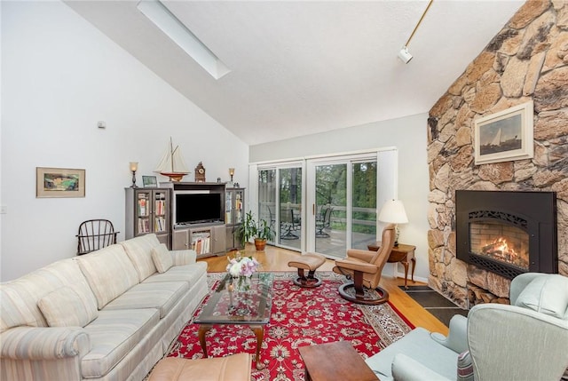 716 Mariner Cir, Webster, NY 14580 - living area with a stone fireplace, wood finished floors, and high vaulted ceiling
