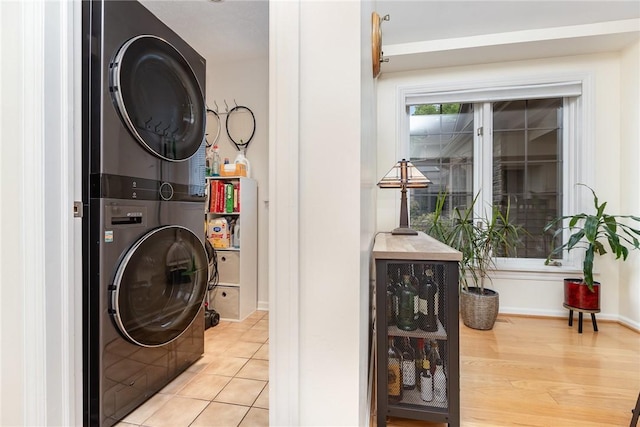 716 Mariner Cir, Webster, NY 14580 - washroom with estacked washer and dryer and baseboards