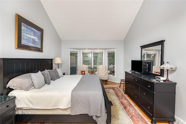 716 Mariner Cir, Webster, NY 14580 - bedroom featuring vaulted ceiling, light wood-style floors, and baseboards