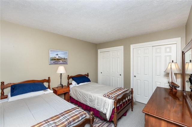 716 Mariner Cir, Webster, NY 14580 - carpeted bedroom with multiple closets and a textured ceiling
