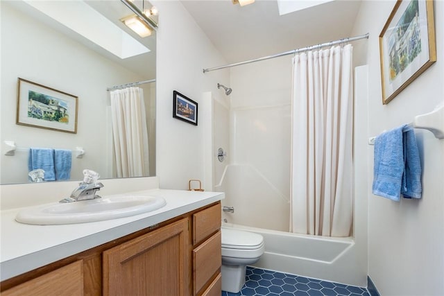 716 Mariner Cir, Webster, NY 14580 - bathroom featuring a skylight, vanity, toilet, and shower / bath combo with shower curtain