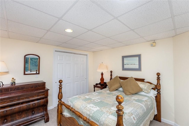 716 Mariner Cir, Webster, NY 14580 - bedroom featuring carpet, a closet, a paneled ceiling, and baseboards