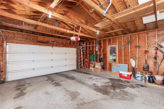 716 Mariner Cir, Webster, NY 14580 - garage featuring a garage door opener