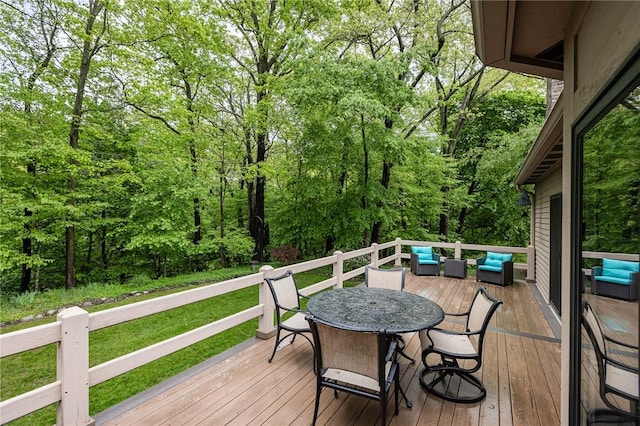 716 Mariner Cir, Webster, NY 14580 - deck with an outdoor hangout area, outdoor dining area, a forest view, and a lawn