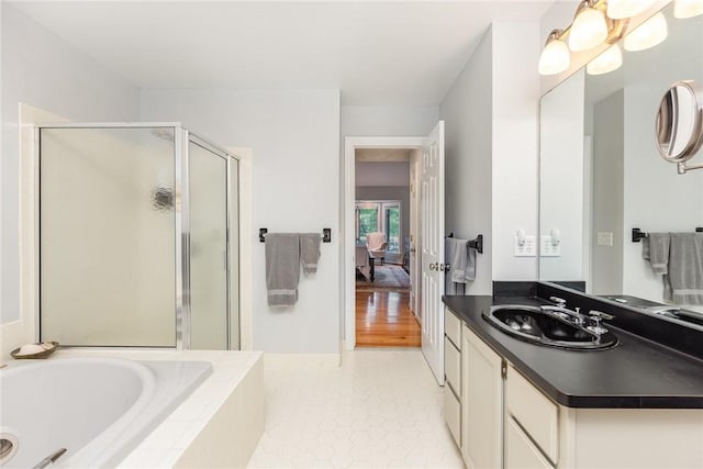716 Mariner Cir, Webster, NY 14580 - full bath featuring a stall shower, connected bathroom, a garden tub, vanity, and tile patterned floors