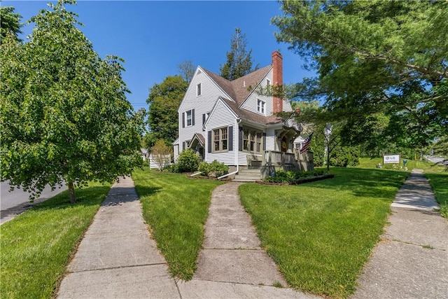 456 N Main St, Benton, NY 14527 - view of front of property with a chimney and a front yard