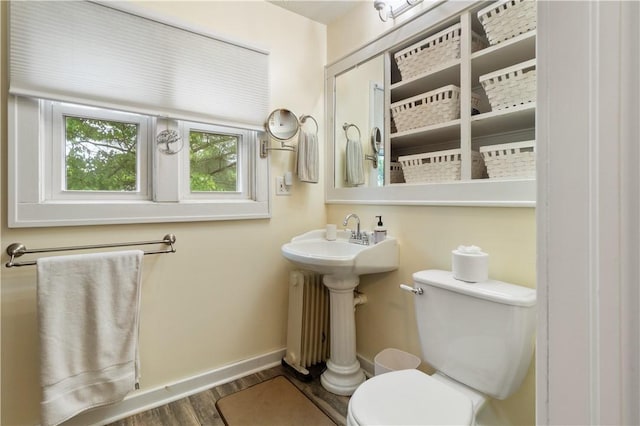 456 N Main St, Benton, NY 14527 - bathroom featuring toilet, wood finished floors, and baseboards
