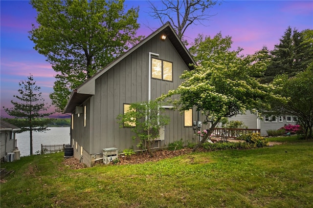 6525 Bonnie Castle Rd, Huron, NY 14590 - view of side of home featuring a lawn, a water view, and board and batten siding
