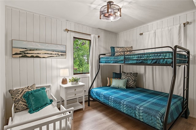 6525 Bonnie Castle Rd, Huron, NY 14590 - bedroom with wood finished floors and wooden walls