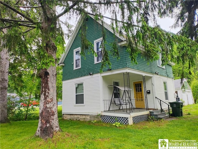 601 Falconer St, Jamestown, NY 14701 - view of front of home with covered porch and a front yard