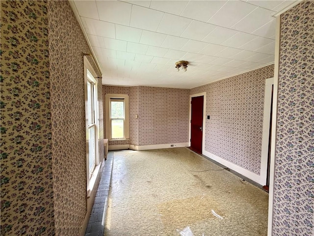9 Weidman St, Unadilla, NY 13849 - spare room featuring crown molding, wallpapered walls, and baseboards