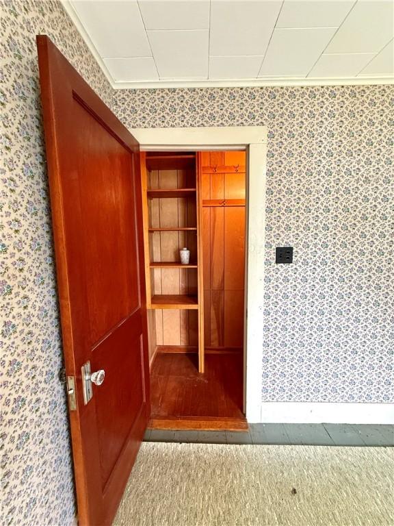 9 Weidman St, Unadilla, NY 13849 - detailed view of wallpapered walls and crown molding