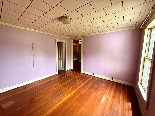 9 Weidman St, Unadilla, NY 13849 - unfurnished bedroom with crown molding, baseboards, and hardwood / wood-style floors