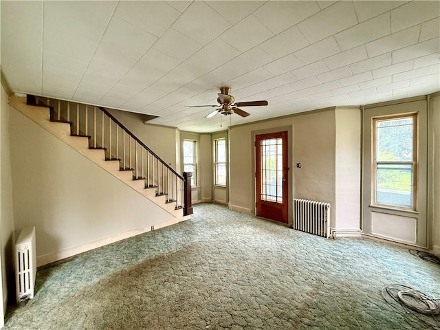 9 Weidman St, Unadilla, NY 13849 - foyer entrance featuring radiator, healthy amount of natural light, carpet floors, stairs, and ornamental molding