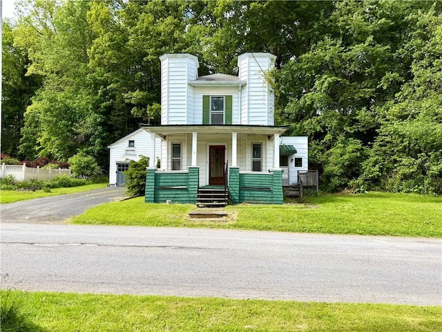 9 Weidman St, Unadilla, NY 13849 - view of front facade featuring a chimney and covered porch