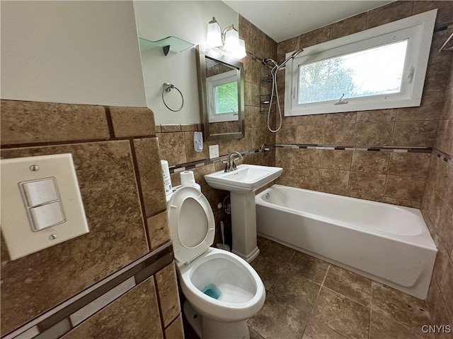 1016 Northway St, Syracuse, NY 13224 - bathroom featuring toilet, shower / tub combination, and tile walls