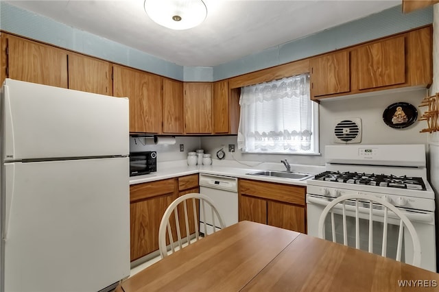 163 Shepard Ave, Tonawanda-Town, NY 14217 - kitchen featuring white appliances, light countertops, a sink, and brown cabinets