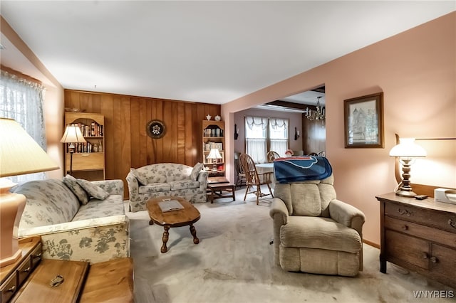 163 Shepard Ave, Tonawanda-Town, NY 14217 - living area with carpet flooring, a chandelier, and wooden walls