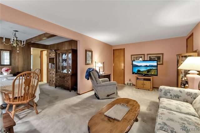 163 Shepard Ave, Tonawanda-Town, NY 14217 - carpeted living room featuring a chandelier and wood walls