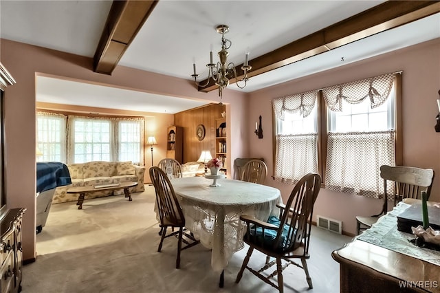 163 Shepard Ave, Tonawanda-Town, NY 14217 - carpeted dining area featuring a chandelier and beam ceiling