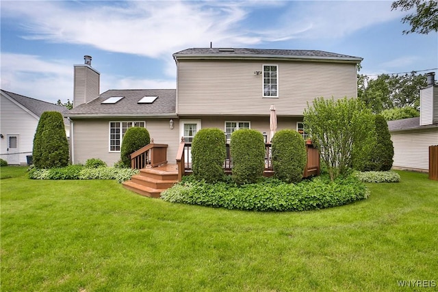 218 Palmdale Dr, Amherst, NY 14221 - rear view of house featuring a wooden deck and a yard