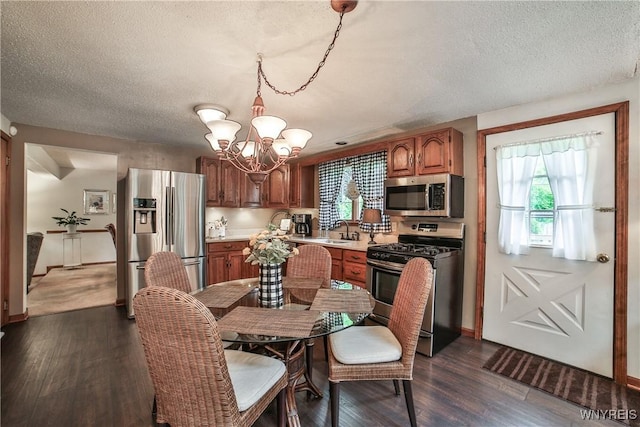 218 Palmdale Dr, Amherst, NY 14221 - dining space featuring a chandelier, dark wood-type flooring, a textured ceiling, and baseboards