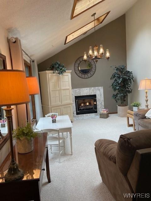 218 Palmdale Dr, Amherst, NY 14221 - living area featuring lofted ceiling, carpet floors, a chandelier, and a high end fireplace