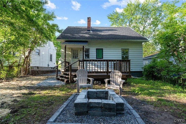 133 Avon Rd, Syracuse, NY 13206 - rear view of property with a fire pit, a chimney, roof with shingles, and a deck