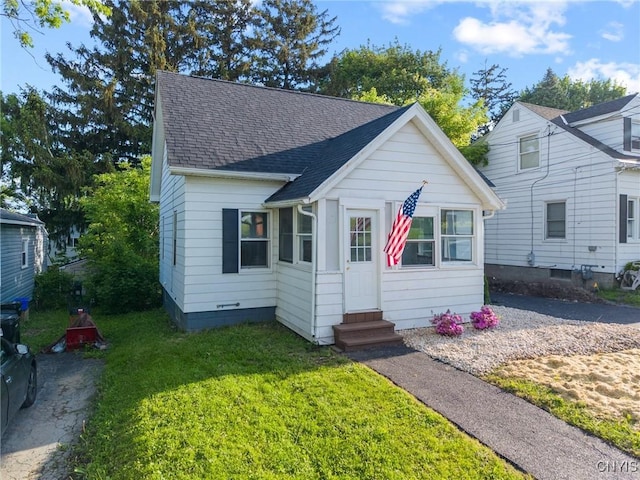 133 Avon Rd, Syracuse, NY 13206 - bungalow with entry steps, roof with shingles, and a front lawn