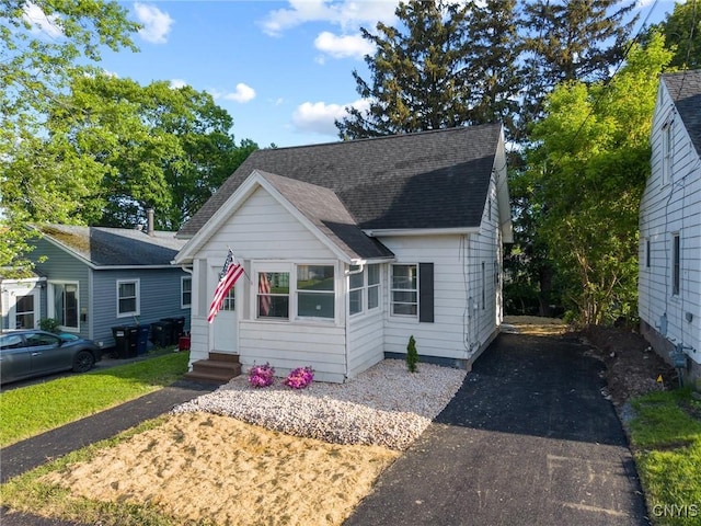 133 Avon Rd, Syracuse, NY 13206 - bungalow featuring entry steps, driveway, and roof with shingles