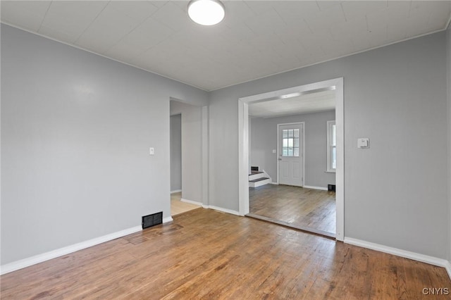 133 Avon Rd, Syracuse, NY 13206 - empty room with wood finished floors and baseboards