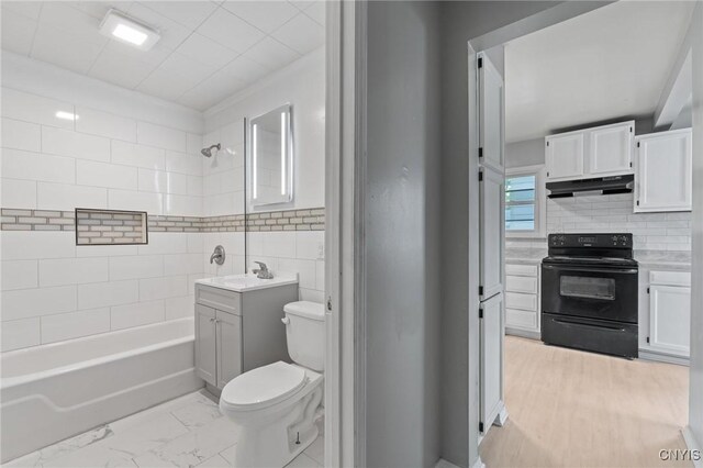 133 Avon Rd, Syracuse, NY 13206 - full bathroom with toilet, vanity, and washtub / shower combination