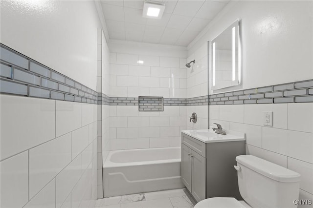 133 Avon Rd, Syracuse, NY 13206 - full bathroom featuring toilet, marble finish floors, tile walls, vanity, and bathing tub / shower combination