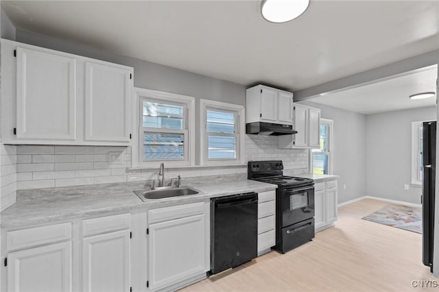133 Avon Rd, Syracuse, NY 13206 - kitchen featuring black appliances, a sink, under cabinet range hood, and white cabinetry