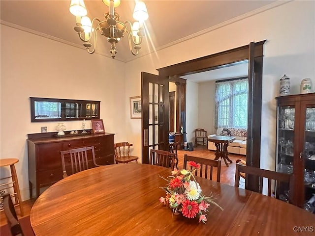 169 Pleasant St, Utica, NY 13501 - dining room featuring a chandelier, ornamental molding, and wood finished floors