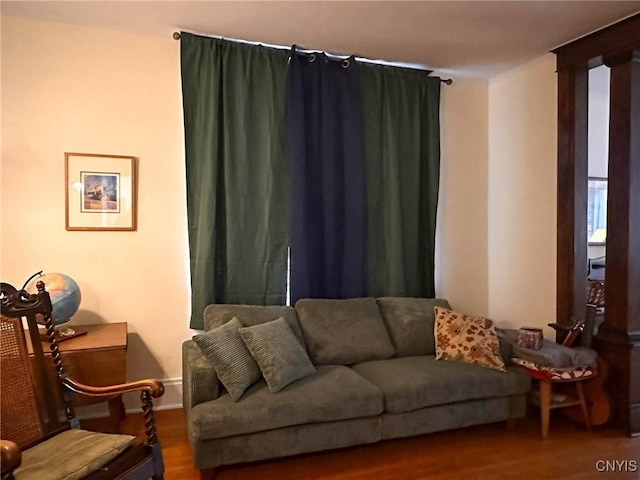 169 Pleasant St, Utica, NY 13501 - living area featuring wood finished floors and baseboards