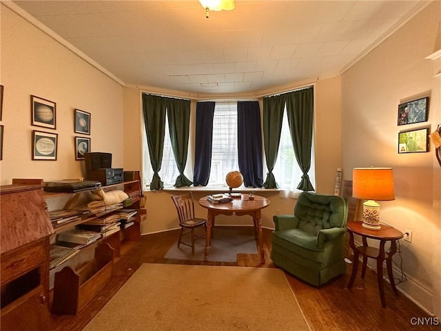 169 Pleasant St, Utica, NY 13501 - living area with wood finished floors, crown molding, and baseboards