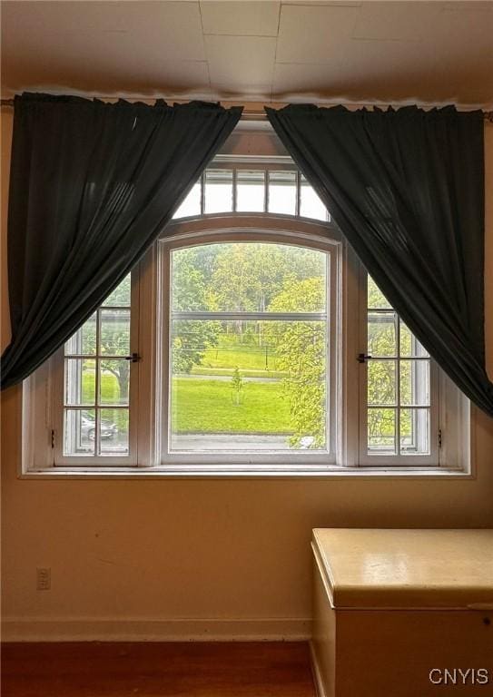 169 Pleasant St, Utica, NY 13501 - bonus room featuring baseboards and wood finished floors
