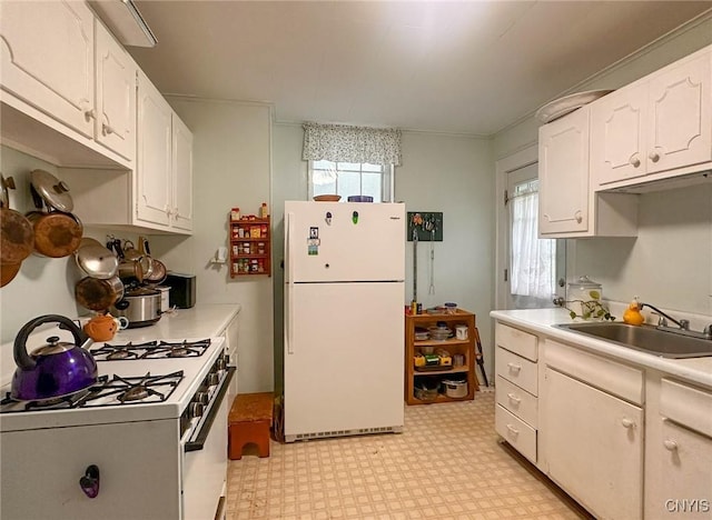 169 Pleasant St, Utica, NY 13501 - kitchen with white appliances, light flooring, a sink, light countertops, and white cabinetry