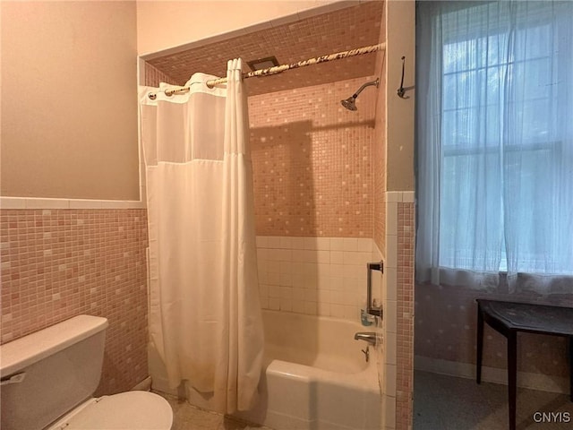 169 Pleasant St, Utica, NY 13501 - full bath with tile walls, shower / tub combo with curtain, toilet, and wainscoting
