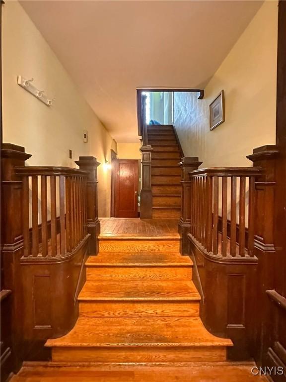 169 Pleasant St, Utica, NY 13501 - staircase with wood finished floors